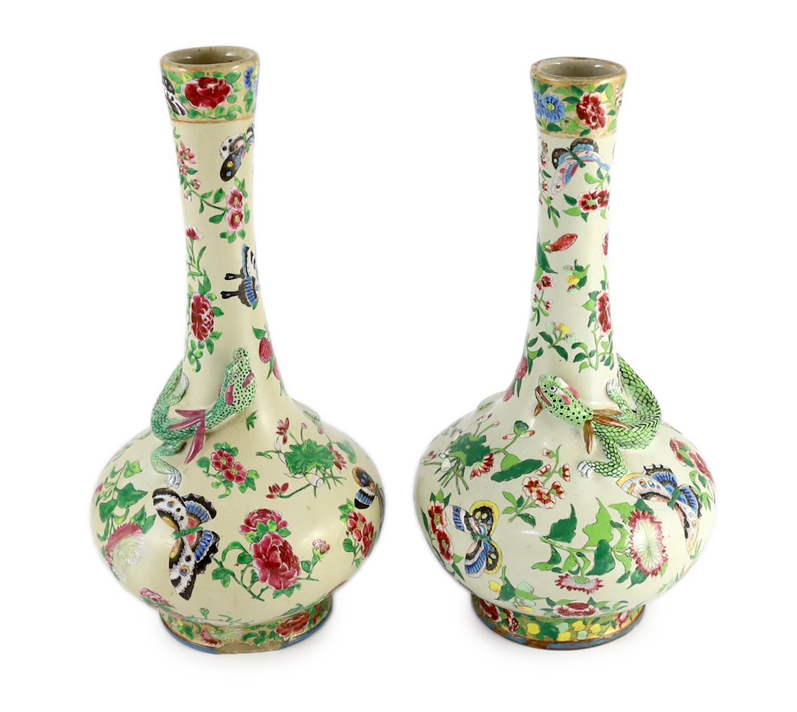 A pair of Chinese enamelled porcelain crackle glaze bottle vases, mid 19th century, 33cm high, chips to feet